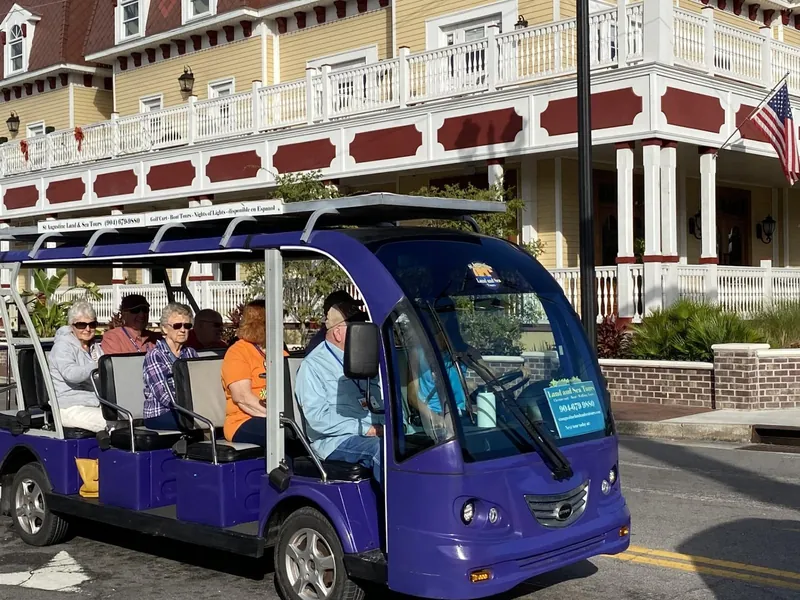 An open electric golf cart by the bayfront, an alternative to St. Augustine carriage tours, Florida